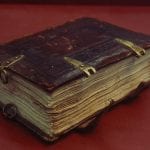 Binding, with rings used to hang the book from on,