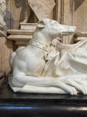 Fig. 33 - Detail of dog and fur-trimmed coat from the Effigy of Margaret of Bourbon, 1526–1528, alabaster, Monastère royal de Brou, Bourg-en-Bresse